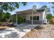 Charming single-story home featuring a covered carport and well-maintained landscaping at 7050 Jenner Ave, New Port Richey, FL 34655