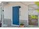 Stylish front door with modern house number and a charming, welcoming entrance at 7050 Jenner Ave, New Port Richey, FL 34655