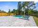 Backyard featuring a pool, a hot tub, and a paved patio at 7050 Jenner Ave, New Port Richey, FL 34655