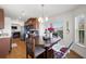 Open dining area with wood table, seamlessly connecting to kitchen and living spaces at 7061 Lamium Ct, Brooksville, FL 34602