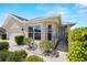 Charming home exterior featuring manicured landscaping, a cozy front porch, and large windows at 7061 Lamium Ct, Brooksville, FL 34602