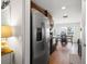 A functional kitchen showcasing stainless steel appliances, wood cabinetry, and ample countertop space at 7061 Lamium Ct, Brooksville, FL 34602