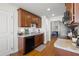 Well-lit kitchen featuring wood floors, granite countertops, and stainless steel appliances at 7061 Lamium Ct, Brooksville, FL 34602