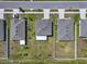 A bird's-eye view of the house highlighting the backyard with screened lanai and neighborhood layout at 718 Tidal Rock Ave, Ruskin, FL 33570