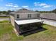 A high-angle view of a screen patio with space for furniture, perfect for enjoying the outdoors at 718 Tidal Rock Ave, Ruskin, FL 33570