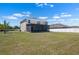 Expansive backyard featuring a screened lanai, offering privacy and outdoor enjoyment at 718 Tidal Rock Ave, Ruskin, FL 33570