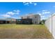 Expansive backyard featuring a screened lanai, offering privacy and outdoor enjoyment at 718 Tidal Rock Ave, Ruskin, FL 33570