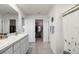 Well-lit bathroom with a double granite vanity and walk-in closet with plenty of storage at 718 Tidal Rock Ave, Ruskin, FL 33570