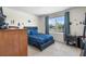 Decorated bedroom with a plush bed, Star Wars themed stickers, and a large window at 718 Tidal Rock Ave, Ruskin, FL 33570
