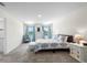 Bright bedroom features a large bed, elegant furnishings, and lots of natural light at 718 Tidal Rock Ave, Ruskin, FL 33570
