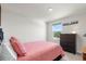 Comfortable bedroom with a large window and dresser with a view of the outdoors at 718 Tidal Rock Ave, Ruskin, FL 33570