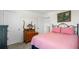 Comfortable bedroom features a decorative wrought iron bed frame and natural light at 718 Tidal Rock Ave, Ruskin, FL 33570