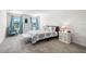 Light-filled bedroom boasts a large bed, elegant furnishings, and plenty of natural light at 718 Tidal Rock Ave, Ruskin, FL 33570