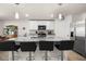 Spacious kitchen featuring a large island with seating, stainless steel appliances, and ample cabinet space at 718 Tidal Rock Ave, Ruskin, FL 33570