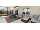 Spacious screened lanai with comfortable seating and dining area for outdoor enjoyment at 718 Tidal Rock Ave, Ruskin, FL 33570