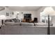 Comfortable living room with a plush gray sofa, fireplace and large television for relaxing evenings at 718 Tidal Rock Ave, Ruskin, FL 33570