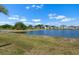 Scenic view of community pond, enhancing the neighborhood's natural beauty and appeal at 718 Tidal Rock Ave, Ruskin, FL 33570