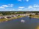 Beautiful water fountain on lake, creating a picturesque backdrop for lakeside properties and homes in the area at 718 Tidal Rock Ave, Ruskin, FL 33570
