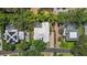 Beautiful aerial view showing the backyard pool, lush greenery, and the home's location on a quiet street at 7314 Hunt Club Ln, Seminole, FL 33776
