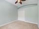 Comfortable bedroom featuring carpet, ceiling fan and a closet at 7314 Hunt Club Ln, Seminole, FL 33776