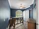 Private office with custom built-in desk, barn door, and ample natural light at 7314 Hunt Club Ln, Seminole, FL 33776