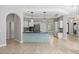 Open concept kitchen features an island, stainless appliances, modern cabinetry, and recessed lighting at 7314 Hunt Club Ln, Seminole, FL 33776