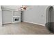 Bright living room featuring a decorative fireplace with blue tile at 7314 Hunt Club Ln, Seminole, FL 33776