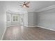 Open living area with lots of natural light and stylish flooring at 7314 Hunt Club Ln, Seminole, FL 33776
