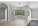 Cozy living space features a view of the pool area, glass doors, and hardwood floors at 7314 Hunt Club Ln, Seminole, FL 33776