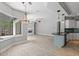 Bright and airy living space with a fireplace, hardwood floors, and access to the screened-in patio and pool at 7314 Hunt Club Ln, Seminole, FL 33776