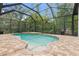 Relaxing enclosed pool area with brick patio at 7314 Hunt Club Ln, Seminole, FL 33776