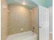 Bright bathroom with tiled shower and new fixtures at 7314 Hunt Club Ln, Seminole, FL 33776