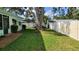 Backyard featuring large tree and white vinyl fencing at 7336 20Th N St, St Petersburg, FL 33702