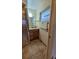 Bathroom features a glass enclosed shower, vanity, and accessibility features at 7336 20Th N St, St Petersburg, FL 33702