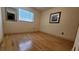 Bright bedroom featuring hardwood floors, neutral walls, and a window with blinds at 7336 20Th N St, St Petersburg, FL 33702