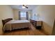 Bedroom features a comfortable bed, dresser, ceiling fan and hardwood floors at 7336 20Th N St, St Petersburg, FL 33702