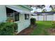 Home exterior with awning and green landscaping at 7336 20Th N St, St Petersburg, FL 33702