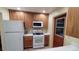 Efficient kitchen featuring modern appliances, wood cabinets, and ample counter space at 7336 20Th N St, St Petersburg, FL 33702