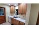 Well-lit kitchen with updated cabinets and countertops, plus stainless steel appliances at 7336 20Th N St, St Petersburg, FL 33702