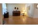 Cozy living room featuring hardwood floors, a piano, and classic furnishings at 7336 20Th N St, St Petersburg, FL 33702