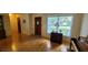 Inviting living room featuring hardwood floors and a large window providing natural light at 7336 20Th N St, St Petersburg, FL 33702