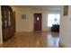 Spacious living room with hardwood floors, an area rug, and natural light from the window at 7336 20Th N St, St Petersburg, FL 33702