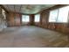 Spacious living room with wall paneling and carpet flooring at 7336 20Th N St, St Petersburg, FL 33702