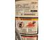 Close-up of water heater label showing model, serial number, and safety warnings at 7336 20Th N St, St Petersburg, FL 33702