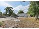 Backyard with a partially filled pool, shed and mature trees at 757 32Nd N Ave, St Petersburg, FL 33704