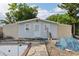 Exterior shot of backyard shed with a pool in need of repair at 757 32Nd N Ave, St Petersburg, FL 33704