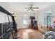 Bedroom with hardwood floors, ceiling fan and bright natural light from the windows at 757 32Nd N Ave, St Petersburg, FL 33704