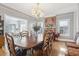 Spacious dining room with a brick accent wall fireplace, hardwood floors, and plenty of natural light at 757 32Nd N Ave, St Petersburg, FL 33704