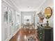 Bright dining area with a decorative front door, hard wood floors, and a small dining table at 757 32Nd N Ave, St Petersburg, FL 33704