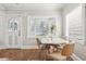 Bright dining area with a decorative front door, hard wood floors, and a small dining table at 757 32Nd N Ave, St Petersburg, FL 33704